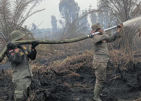 Mengurai Kabut Meretas Bara, Satpol PP Riau Berjuang di Daerah Hutan Dayun Kab Siak